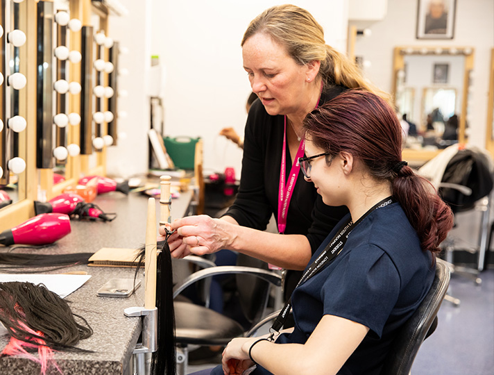 Students working in the college Salon