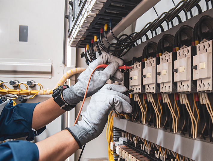 Hands wiring a circuit