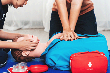 Student practicing first aid on a dummy